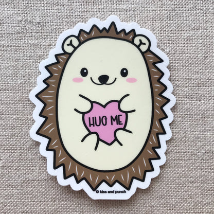 Cute hedgehog sticker says hug me on fabric
